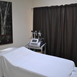 A bed in a patient room at Jimenez Chiropractic Med-Spa in Miami, FL